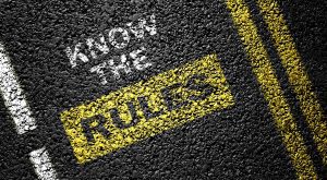 know the rules painted on asphalt