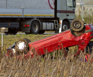 flipped red car crash